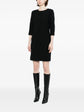 Pre-owned CHLOÉ tailored silk dress displayed on a hanger, showcasing its elegant design and smooth fabric.