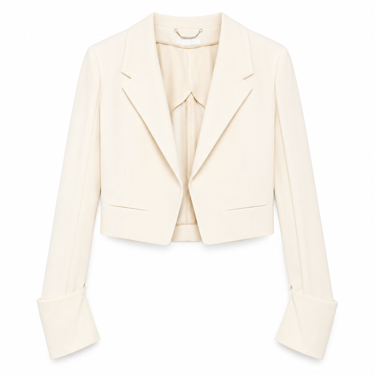 Cream cropped blazer by Chloé, tailored fit with structured lapels and long sleeves, styled on a mannequin.