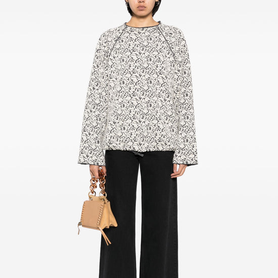 Chloé patterned jacquard wool jumper, a stylish knit top with intricate design and cozy texture, displayed on a neutral background.