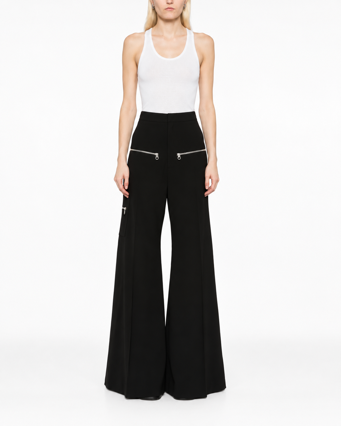 Chloé flared zip trousers featuring high waist, wide leg design, and front zipper detail, shown in a stylish fashion photograph.