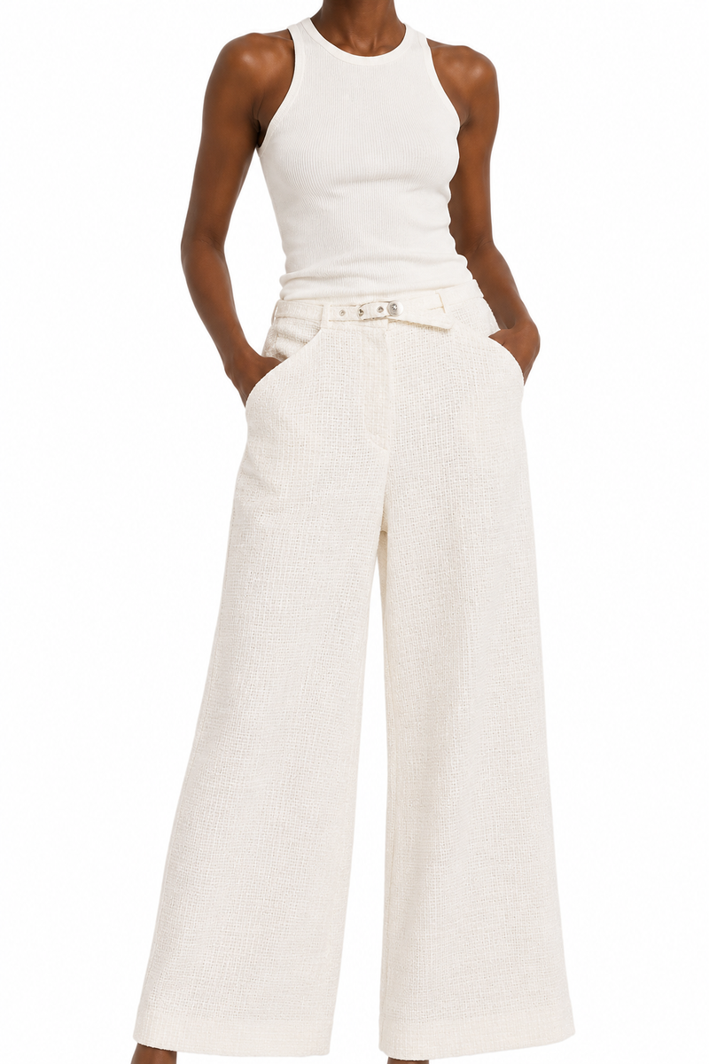 Cream Chanel tweed trousers with tailored fit and classic texture, showcased in a stylish close-up image.