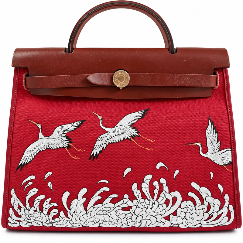 Hermès Herbag 31 top handle bag in red canvas with custom crane and floral design, showcasing elegant craftsmanship.