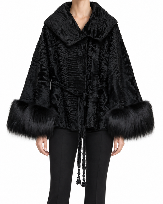 Dior black cuffed jacket with oversized collar, textured finish, front fastening, drawstring tie detail and dramatic fur-trimmed sleeves.