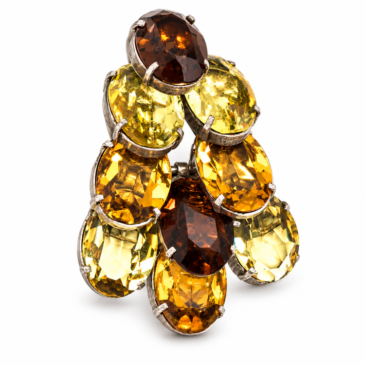 Dior crystal-embellished brooch with sparkling clear crystals on a silver-tone metal base, showcasing elegant jewelry design