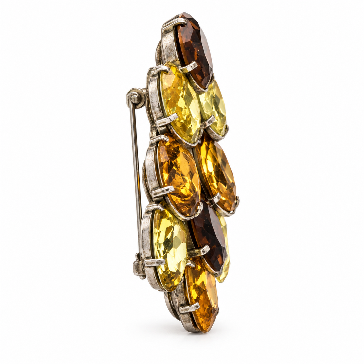 Dior crystal-embellished brooch with sparkling clear crystals on a silver-tone metal base, showcasing elegant jewelry design