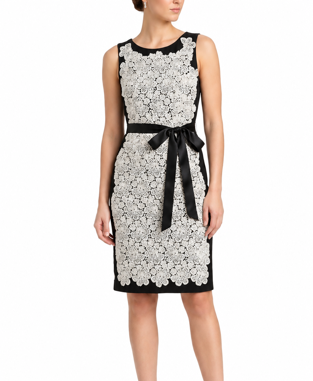 Black and white floral lace midi dress by Dolce & Gabbana featuring intricate lace details and a flowing tulle skirt.