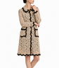 Dolce & Gabbana floral crochet lace coat with intricate lace patterns and elegant design, displayed on a hanger.