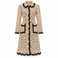 Dolce & Gabbana floral crochet lace coat displayed on a hanger, showcasing intricate lace patterns and delicate floral embroidery.