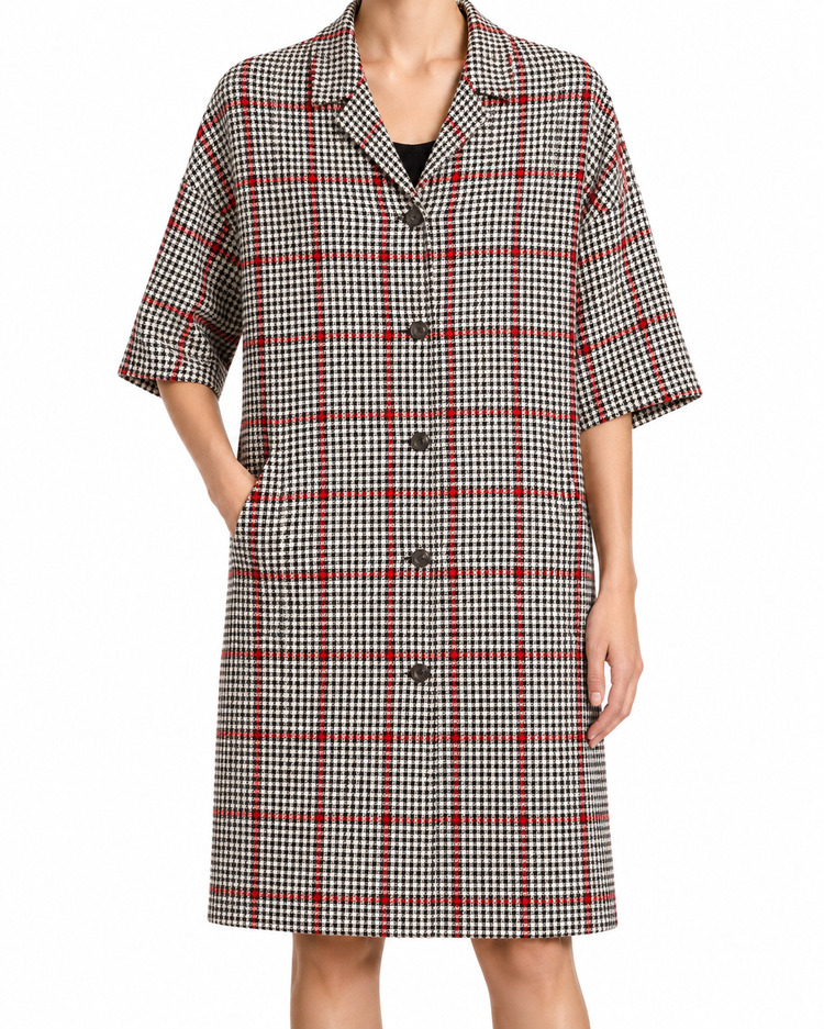 Dolce & Gabbana herringbone 3/4 sleeve coat displayed on a hanger, showcasing classic pattern and tailored design.