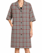 Dolce & Gabbana herringbone 3/4 sleeve coat displayed on a hanger, showcasing classic pattern and tailored design.