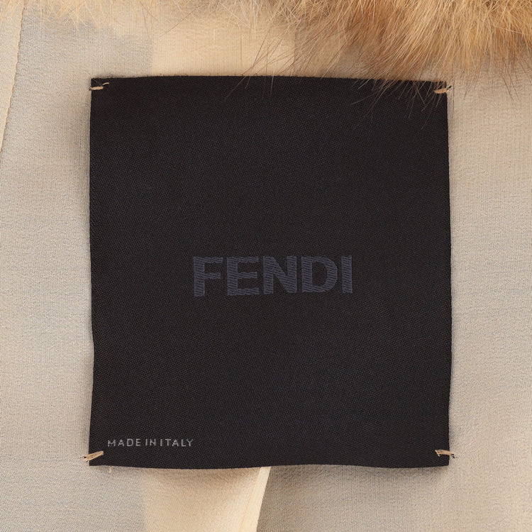 Fendi beige and brown hooded fur gilet with plush texture, sleeveless longline silhouette, rounded shoulders and vertical panel detailing.