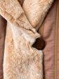 Close-up of Fendi sheared mink fur reversible coat showing fastening details and luxurious texture.