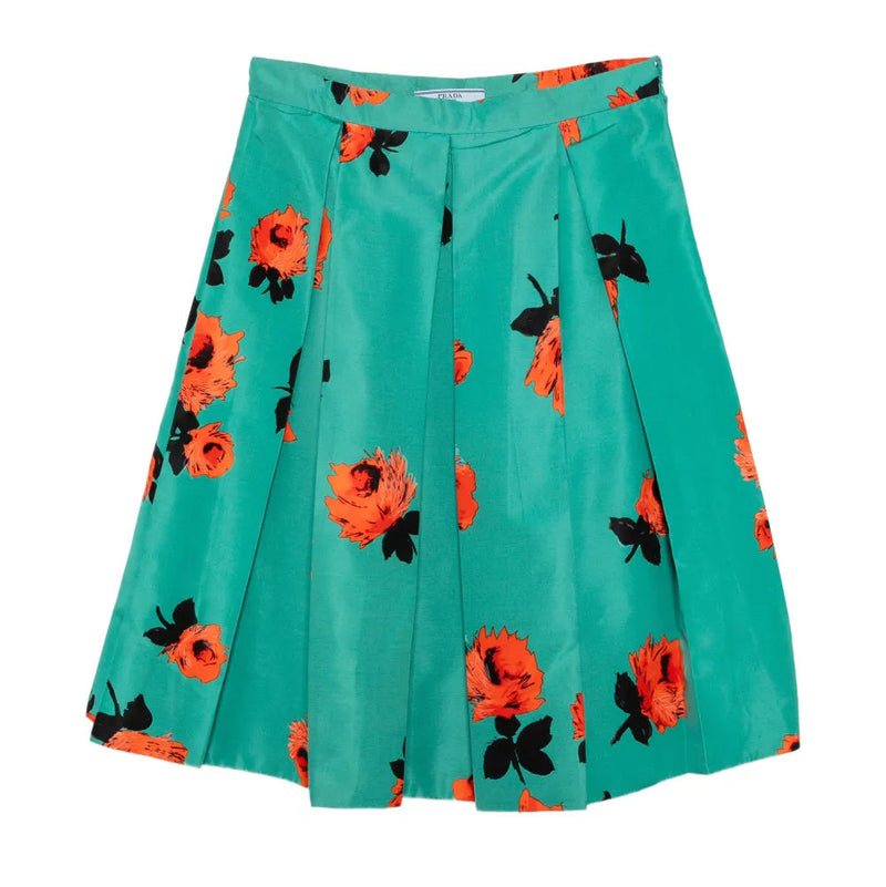 Prada floral turquoise pleated skirt with flowing fabric and intricate pattern, perfect for stylish summer outfits.