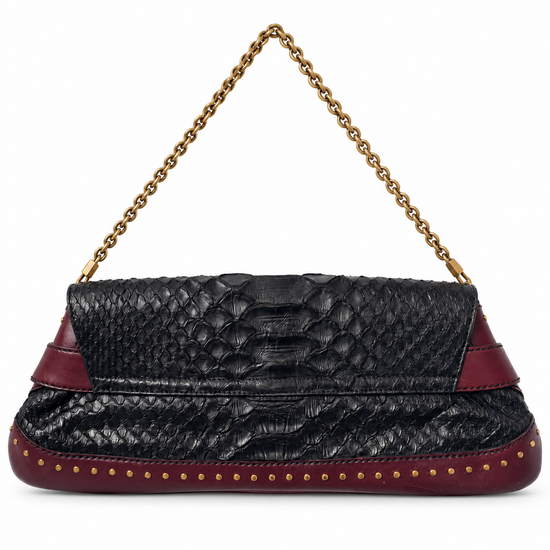 Python shoulder bag with horsebit detail from the 2003 Tom Ford collection, featuring Gucci branding and elegant design.