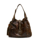 Gucci medium Jackie hobo shoulder bag with beige and black leather, gold-tone hardware, and signature GG logo detail.