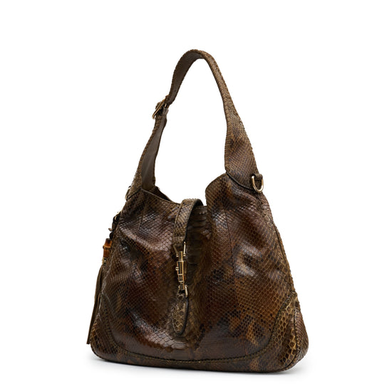 Gucci medium Jackie hobo shoulder bag with signature GG logo and leather strap, stylish and versatile for everyday wear.
