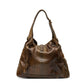 Gucci medium Jackie hobo shoulder bag with signature monogram canvas and leather accents, featuring a top handle and adjustable strap.