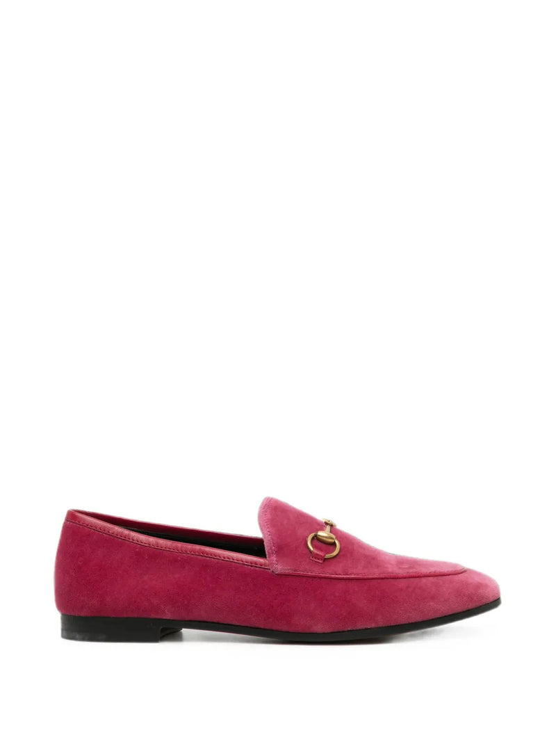 Pink velvet Gucci loafers featuring a classic slip-on design and elegant stitching, perfect for stylish casual wear.