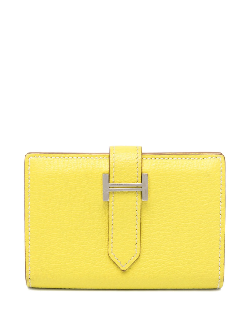 Hermès Bearn yellow card holder wallet with multiple card slots and sleek design, made from premium leather.