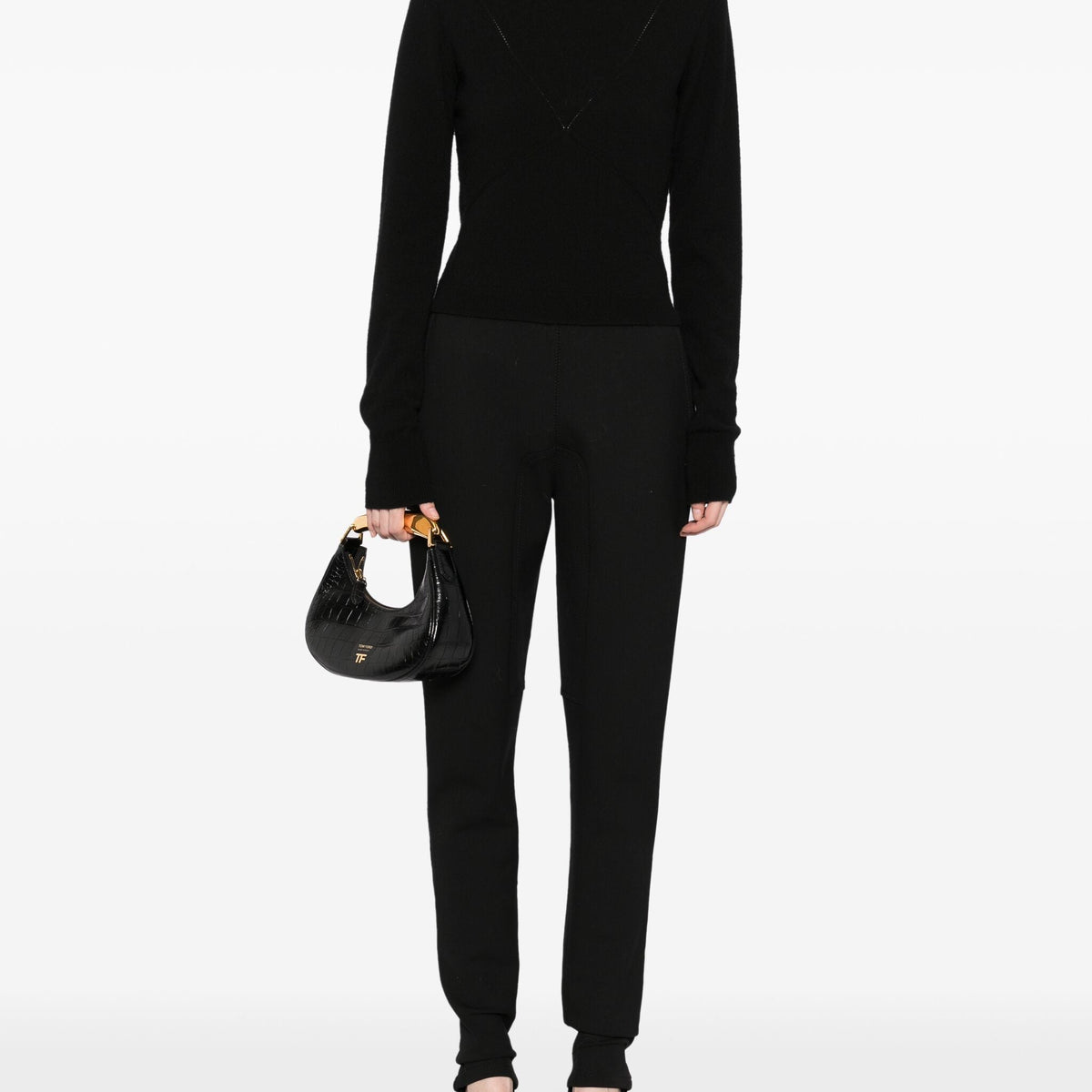 Hermès black riding trousers with a tailored fit, featuring sleek fabric and classic styling for equestrian or casual wear.