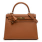 Hermès Kelly II Sellier 28 bag in Gold Epsom leather with gold-tone hardware, white contrast stitching, rolled top handle, detachable shoulder strap, front flap, belted straps, clochette, and padlock.