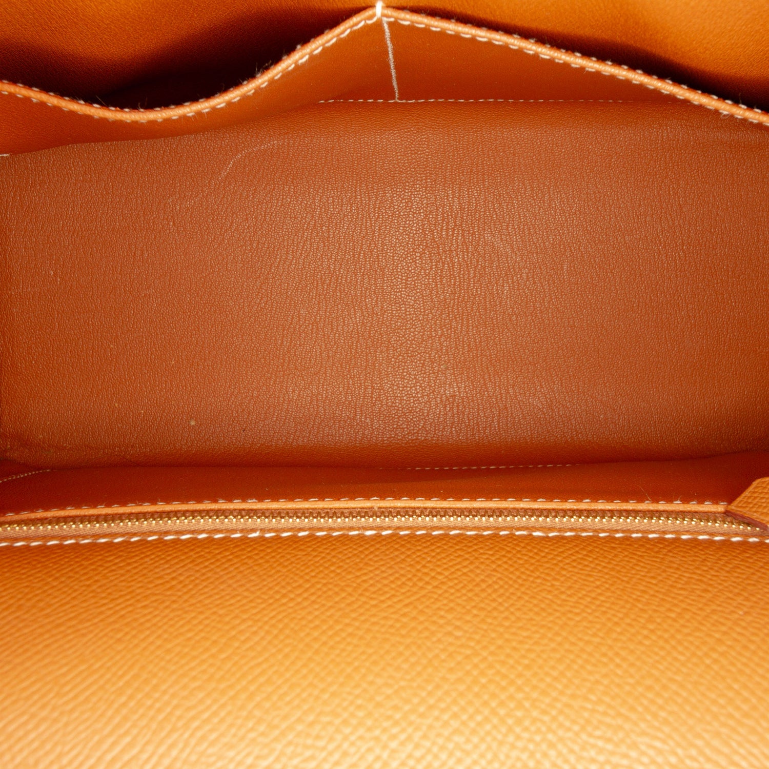 Hermès Kelly II Sellier 28 bag in Gold Epsom leather with gold-tone hardware, white contrast stitching, rolled top handle, detachable shoulder strap, front flap, belted straps, clochette, and padlock.