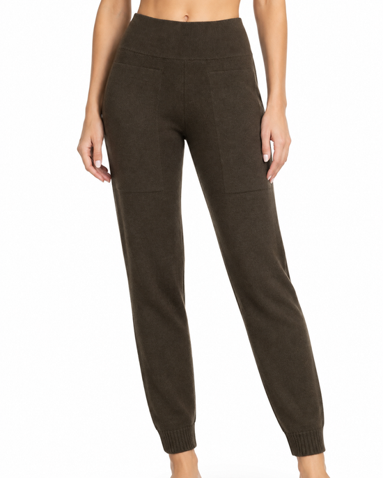 Hermès brown knitted lounge trousers showing a cozy, relaxed fit with ribbed cuffs and a soft knit texture.