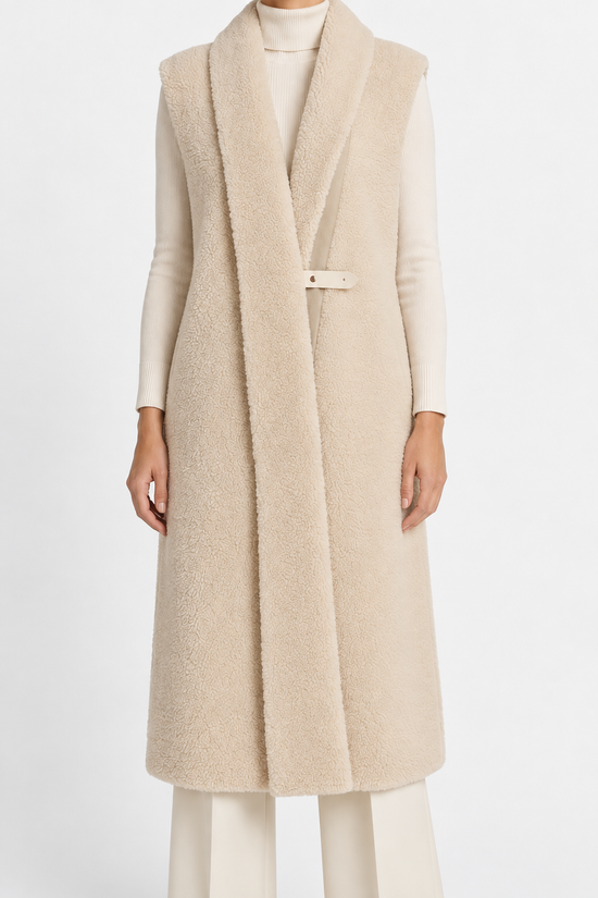 Hermès cream sheepskin gilet with silk scarf interior, stylish blazer jacket featuring luxurious fur and elegant design.