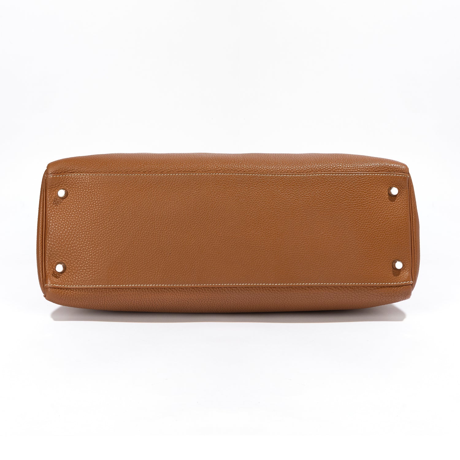Hermès Kelly 40 Gold leather handbag with gold hardware, featuring structured design and top handles, by Rewind Vintage Affairs.