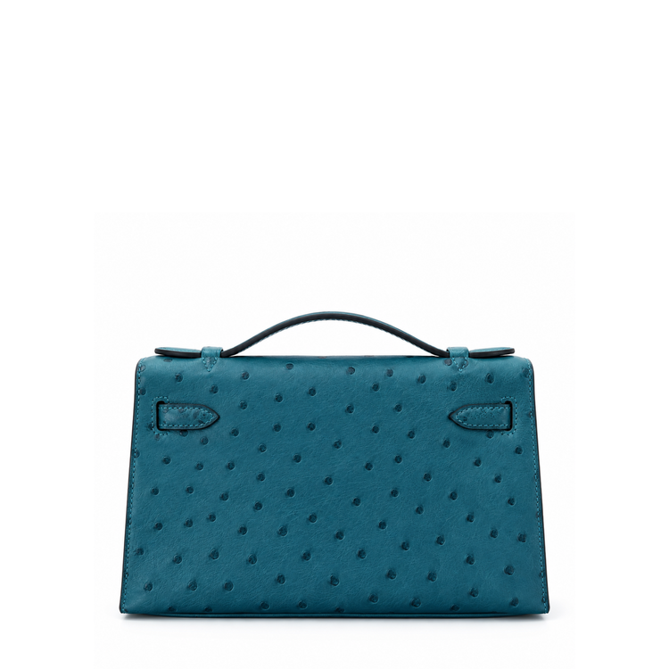 Hermès Kelly Pochette Bleu Colvert ostrich leather top handle bag with gold hardware, showcasing its elegant design and luxurious texture.