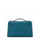 Hermès Kelly Pochette Bleu Colvert ostrich leather top handle bag with gold hardware, showcasing its elegant design and luxurious texture.