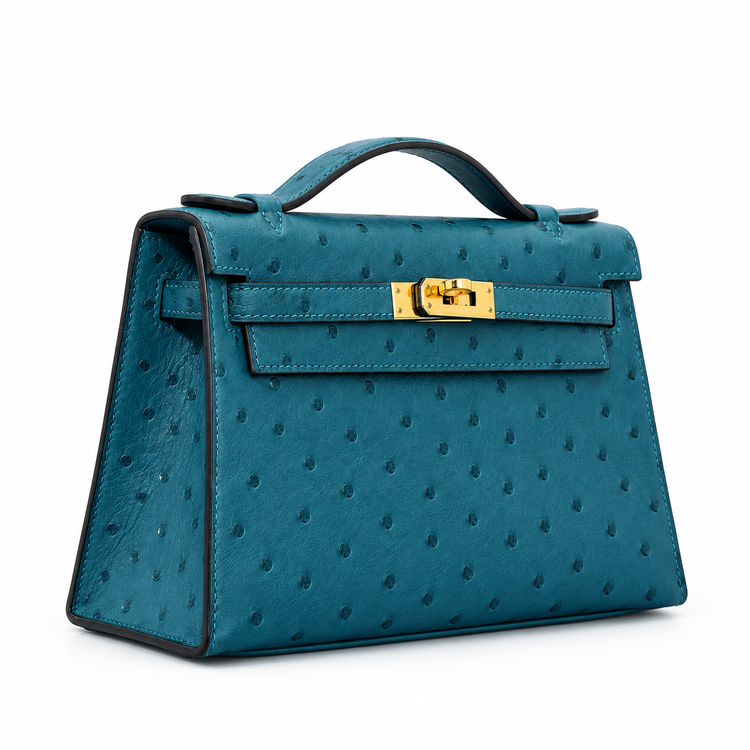 Hermès Kelly Pochette in Bleu Colvert ostrich leather with gold hardware, stylish handbag with elegant design and textured finish.