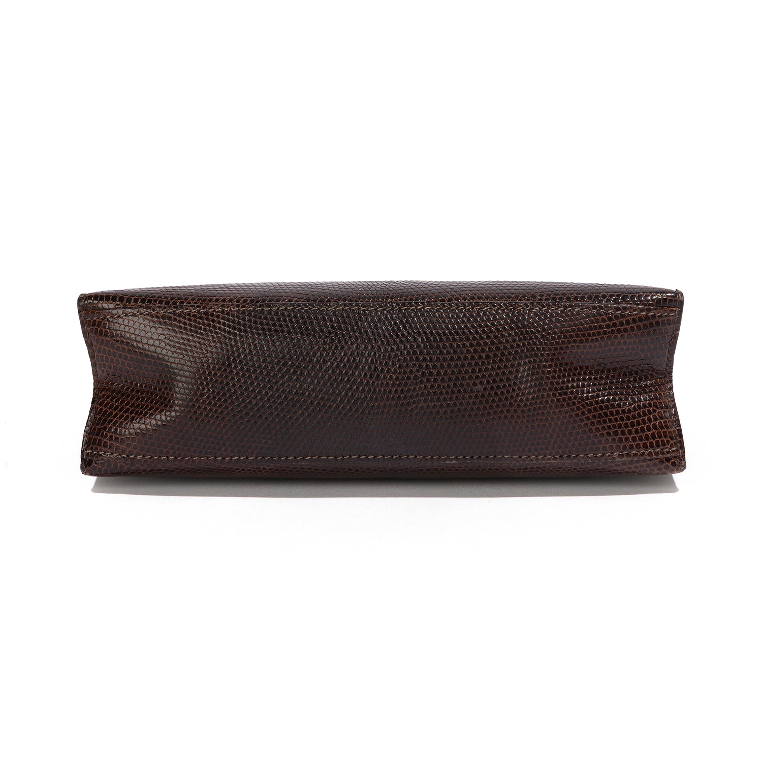 Hermès Chocolat Niloticus Lizard Kelly Pochette handbag with smooth leather finish and elegant design.