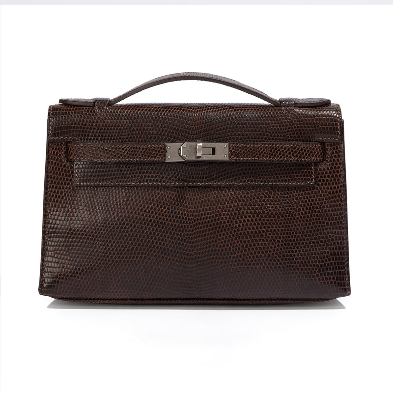 Hermès Chocolat Niloticus Lizard Kelly Pochette handbag with sleek design and elegant leather details.