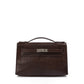 Hermès Chocolat Niloticus Lizard Kelly Pochette handbag with sleek design and elegant leather details.