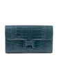 Hermès Constance Wallet in leather with gold hardware, featuring multiple card slots and a sleek, compact design.
