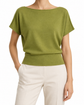 A woman wearing a light olive green knit top with a wide boat neckline and short dolman sleeves, paired with off-white trousers, shown against a plain white background. - Hermès Green Cashmere Top tops