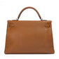 Rewind Vintage Affairs Hermes Kelly 40 Gold PHW bag with structured design and gold hardware, crafted in luxurious leather.
