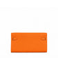 Hermès Kelly To Go wallet in GHW, shown from the back, featuring sleek leather design and gold hardware accents.