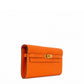 Hermès Kelly To Go wallet in GHW with side view showing compact design and luxurious leather craftsmanship.