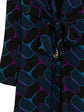 Gucci horsebit print dress featuring a stylish design, perfect for fashionable occasions, shown from a side view.
