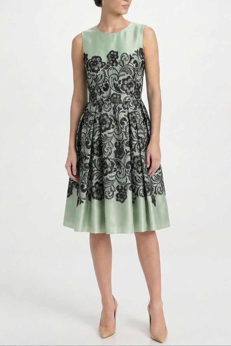 Elegant mint silk floral lace print dress by Dolce & Gabbana featuring intricate lace details and a flowing silhouette.