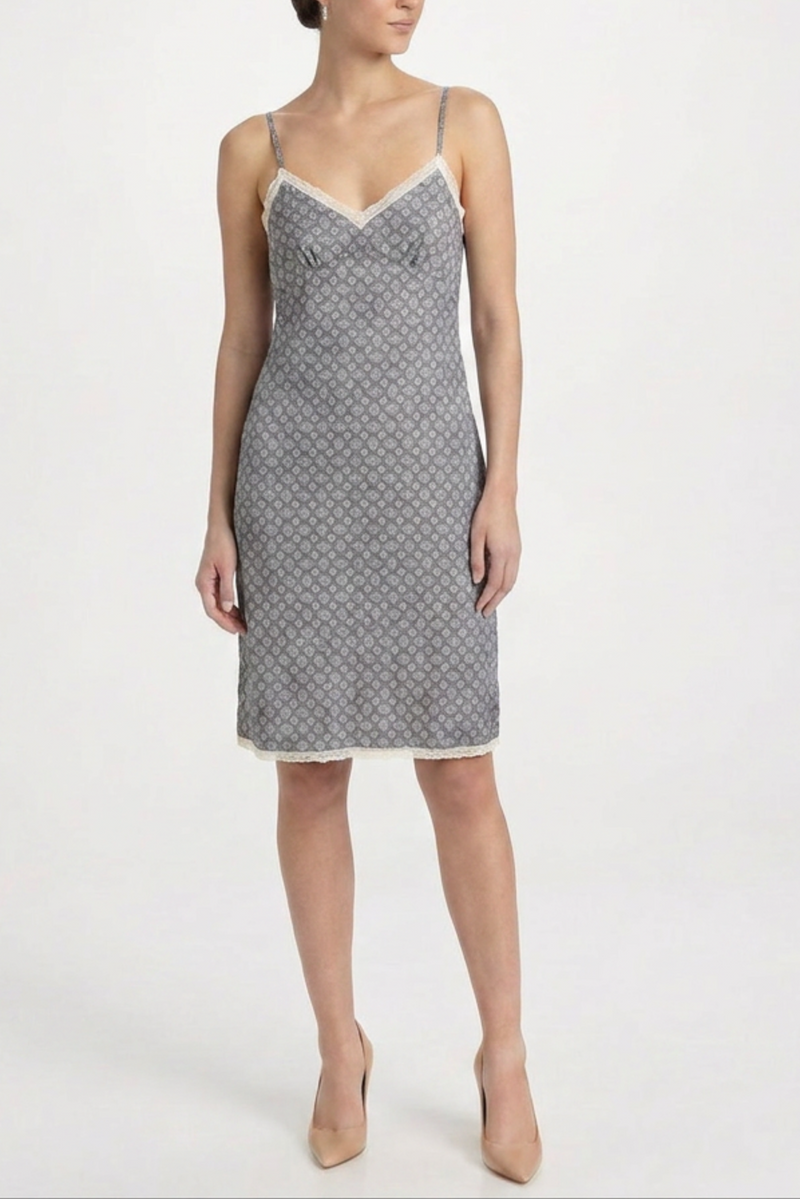 Prada blue silk slip dress hanging on a white background, showcasing smooth fabric and elegant design.