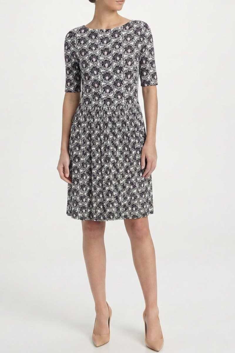 Prada printed silk gathered dress with flowing fabric and elegant design, featuring a vibrant pattern and stylish silhouette.