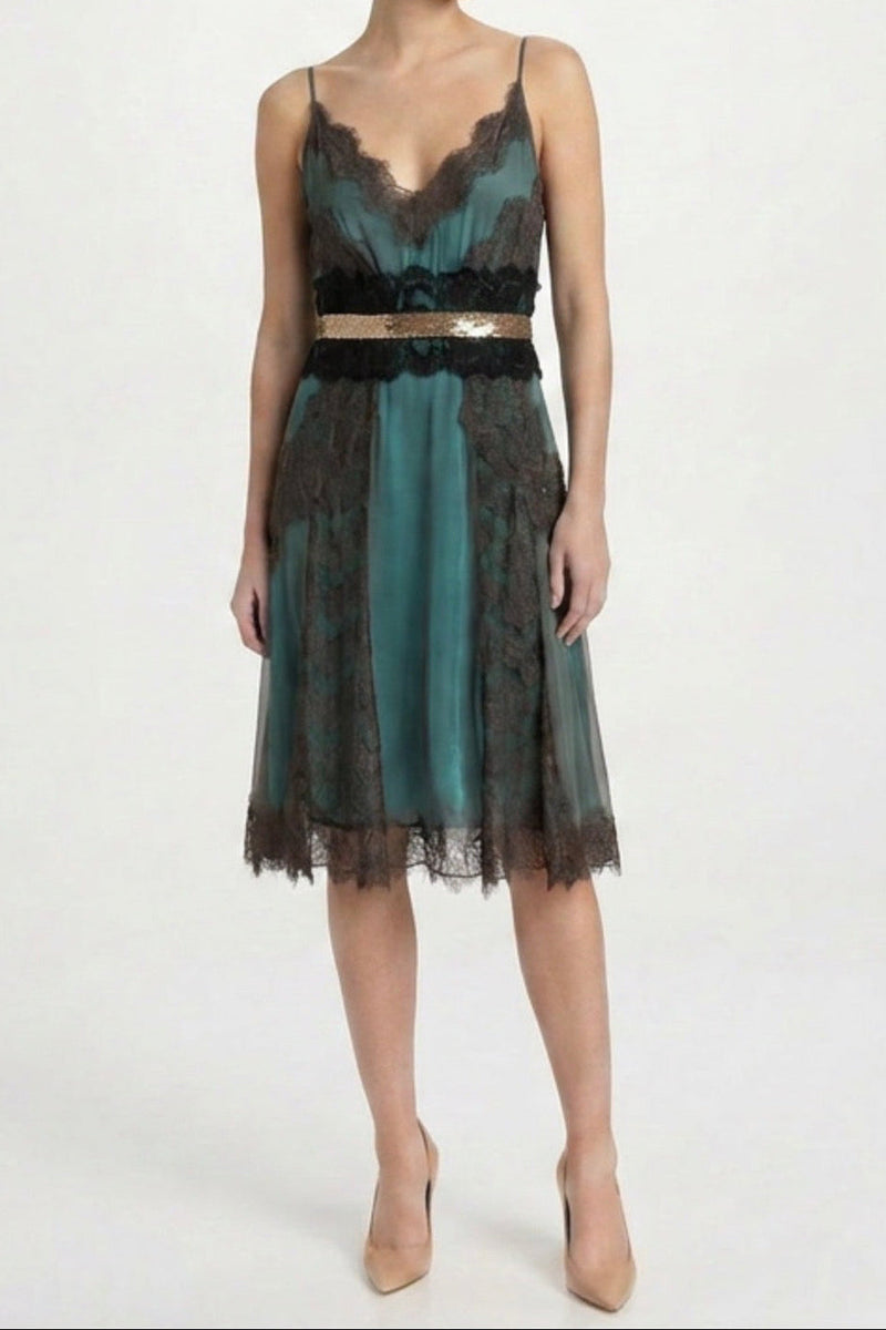 Turquoise cocktail dress by Dolce & Gabbana, elegant sleeveless design with fitted waist and flowing skirt, perfect for formal events.