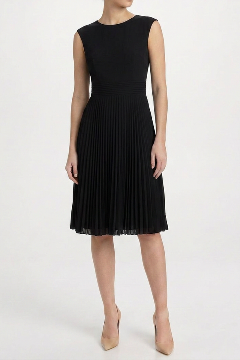 Black Prada pleated midi dress hanging on a mannequin, showcasing elegant fabric and classic design details.