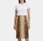 Beige leather Prada A-line skirt displayed on a hanger, showcasing smooth texture and classic silhouette.