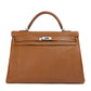 Rewind Vintage Affairs Hermes Kelly 40 Gold PHW bag with structured design and gold hardware, crafted in luxurious leather.