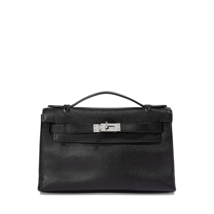 Hermès Kelly Pochette in black swift leather, compact handbag with gold hardware, elegant and luxurious design.