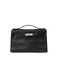 Hermès Kelly Pochette in black swift leather, compact handbag with gold hardware, elegant and luxurious design.